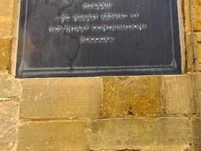 Chandos Almshouses plaque and gargoyle, Winchcombe