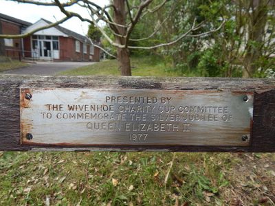 Plaque  on bench on High Street (B1028)
