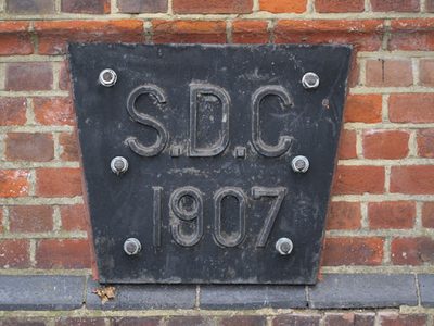 Plaque on the bridge over Pymme's Brook, Powys Lane, N13