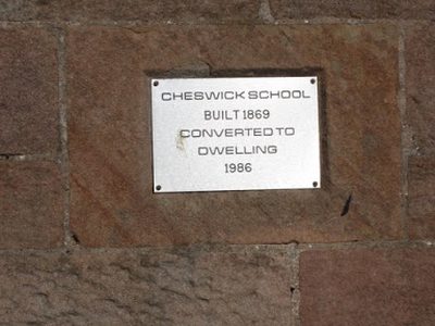 Plaque in wall of former Cheswick School