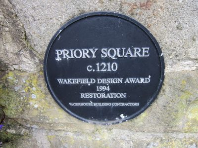 The plaque at Priory Square, Walton