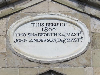 Plaque on a building on the east side of Trinity House Yard