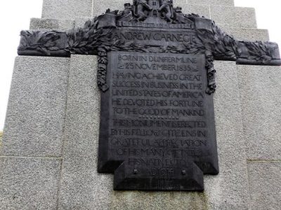 Bronze plaque on the plinth of Carnegie's statue in Pittencrieff Park