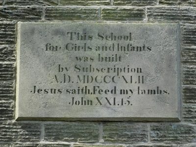 Plaque on the old girls and infants school in Woolley