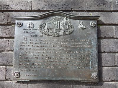 Plaque below Lady statue