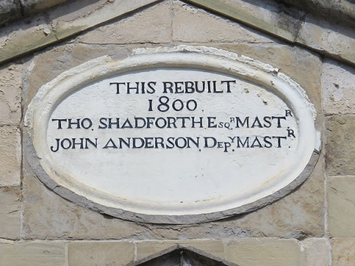 Plaque on a building on the east side of Trinity House Yard